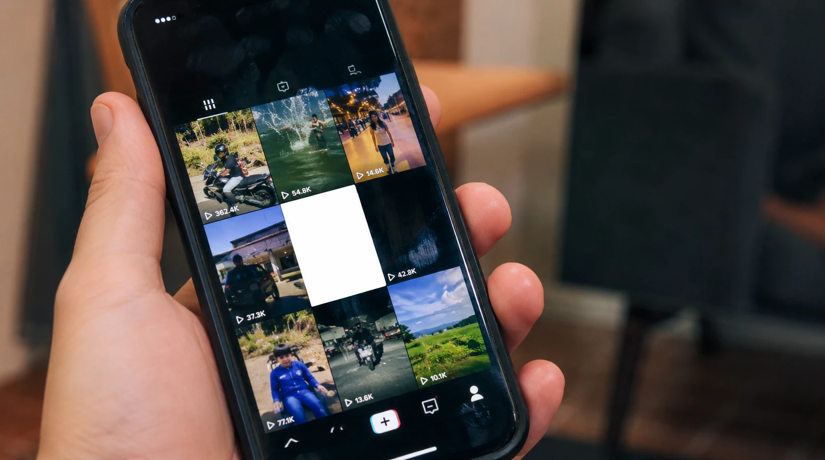 Phone screen showing white blank thumbnail instead of TikTok video cover after posting